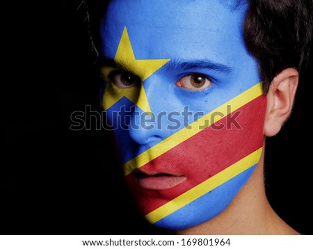 Flag of Democratic Republic of Congo Painted on a Face of a Young Man