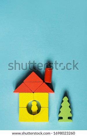 House made of blocks on a blue background. Stay home, stay save. Flat lay, space for text.