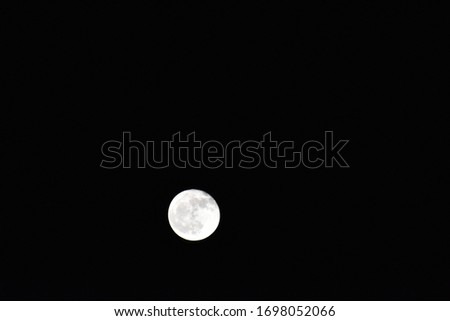  a picture of the moon in the night sky.