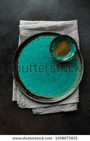 Table setting with cutlery and napkin on concrete background with copy space