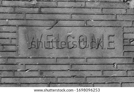 Abandoned Welcome sign in loneliness black and white 