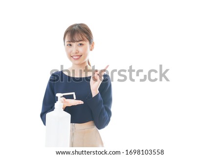 Young woman wearing a mask giving OK sign