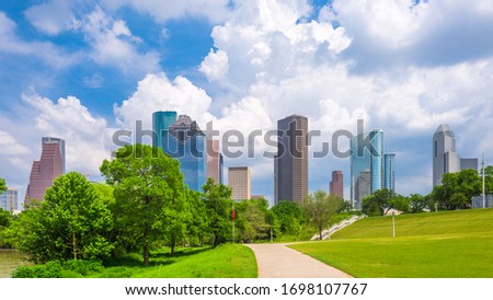 Houston, Texas, USA downtown city skyline and park in the afternoon.