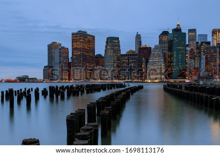 New York City. Manhattan downtown skyline skyscrapers in dusk evening. with illuminated