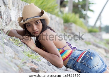 Girl resting on stones