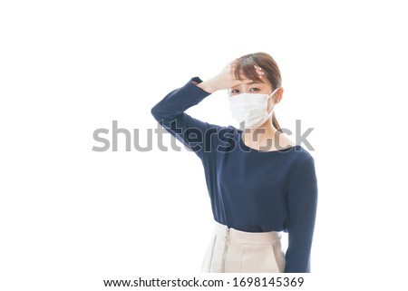 Young woman wearing a mask having symptoms of cough
