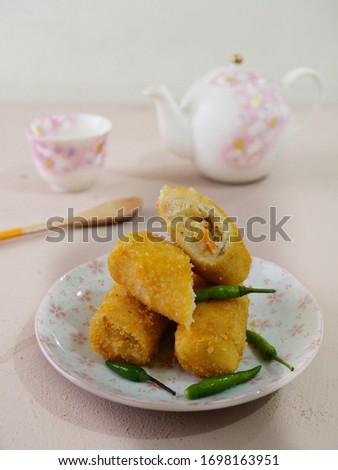 Risoles or rissole is a snack food in Indonesia.The skin is made from batter in the same fashion as a flat crepes. filled with Béchamel,chicken, and diced vegetables - including carrot, celery, potato