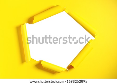 Torn yellow paper with white background. Space for text. Clipping path included. 3d illustration