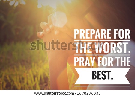 Inspirational quote - Prepare for the worst. Pray for the best. With blurry vintage background of young girl looked down with hands clasped in prayer at sunset.