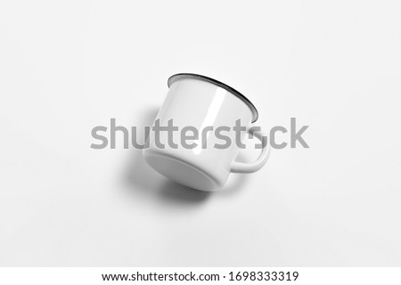 White blank Enamel Mug Mock-up isolated on white background. Blank cup for branding. High-resolution photo.