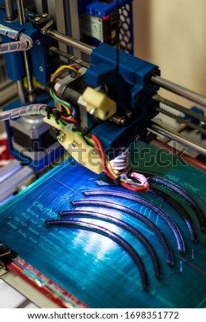 Fighting with SARS-CoV-2/Coronavirus and COVID-19 desease: 3D printer is printing plastic parts of medical protective shields