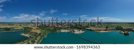 Panorama from above of an excavated lake in Hessischer Ried / Germany