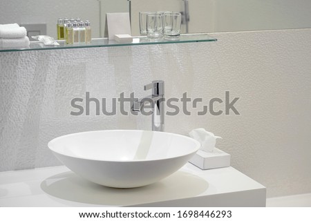 Interior of bathroom with washbasin and faucet. Bathroom interior sink with modern design in luxury hotel. Royalty-Free Stock Photo #1698446293