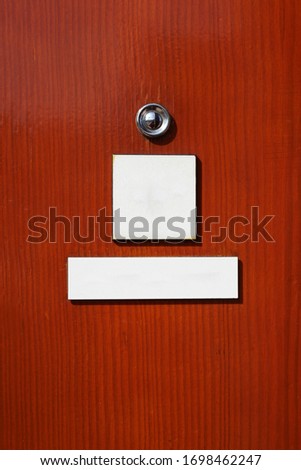 Spy on a door with white signs