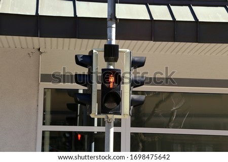 Red traffic light, for pedestrians on the street