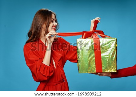 Merry beautiful woman from holiday gift to christmas holiday vacation
