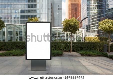 Blank street billboard poster stand mock up in the city business district.