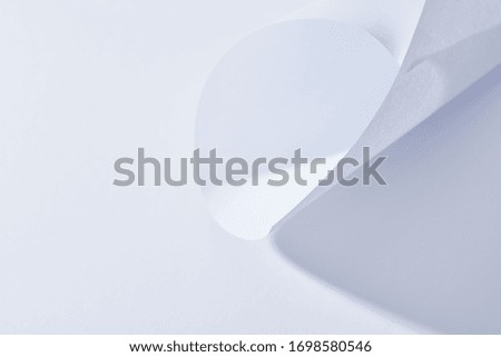 close up view of curved paper sheet on white background