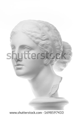 Gypsum copy of ancient statue Venus head isolated on white background. Plaster sculpture woman face. Royalty-Free Stock Photo #1698597433