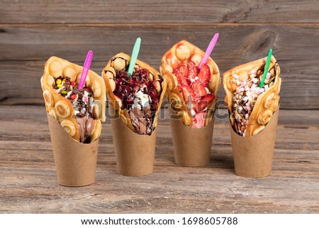 four different types of bubble waffle ice cream to go Royalty-Free Stock Photo #1698605788