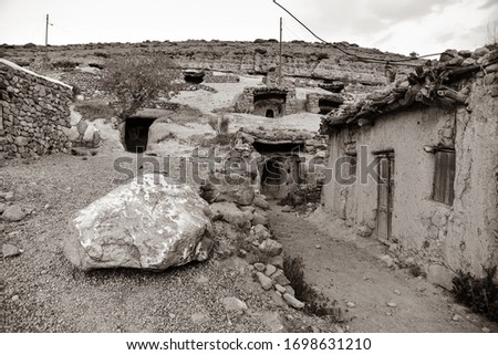 black and white photography.famous tourist Persian attraction:old ancient troglodyte village of Meymand,Central District of Shahr-e Babak,Kerman Province in Iran.traditional man dwelled cave houses  