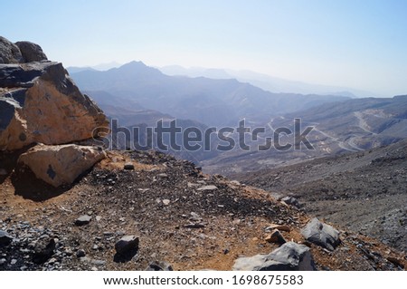 A magnificent mountain landscape.  Mountains are practically devoid of vegetation. Al Hajar Mountains, Oman.