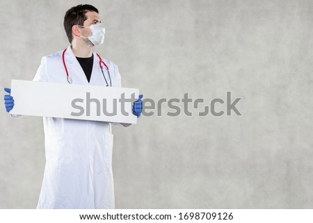 doctor holds boards with or for information, warning concept