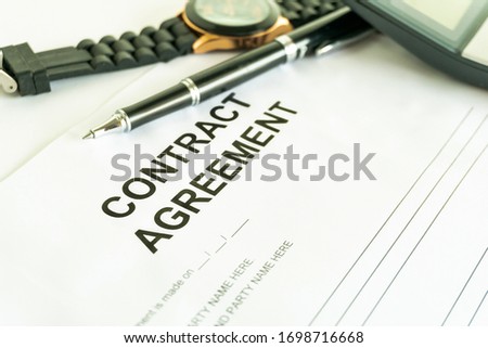contracts agreement sign on document paper with black pen Royalty-Free Stock Photo #1698716668
