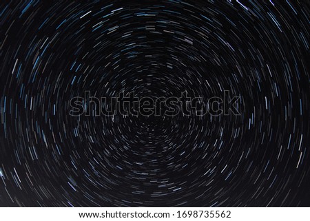 Strar Trails with the North Star. Night space motion stars