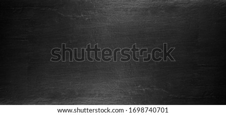 Black polished metal steel texture abstract background.