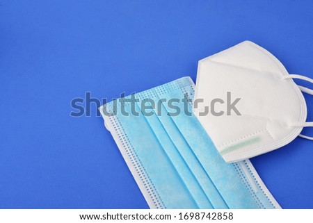 Two masks on a blue background,Concept of medical protection