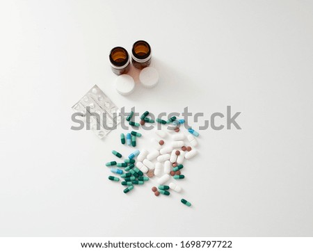 Beautiful on a white background, isolated for use.
Colorful oral medications shaken off on white background