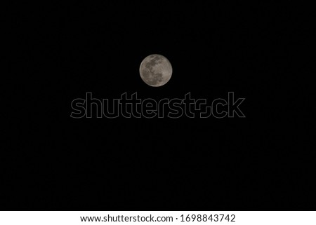Super Moon or Pink Moon shot with black background. 