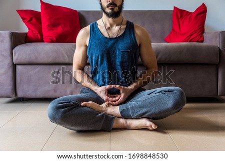 Man trying for meditation indoor