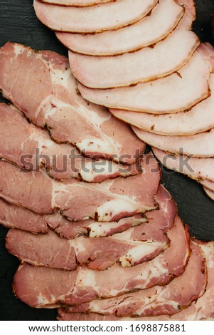 Composition of aromatic, smoked cold cuts. Close up. Breakfast before beer.