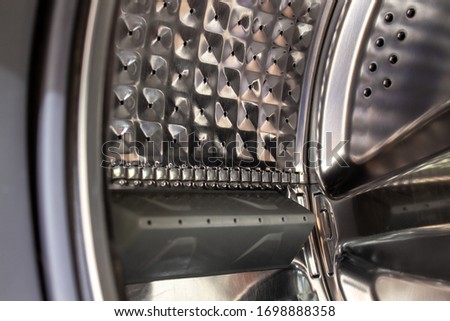 The drum of the washing machine. Details of the washing machine