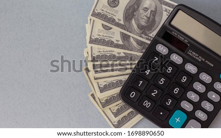Money, business, calculator on a blue background