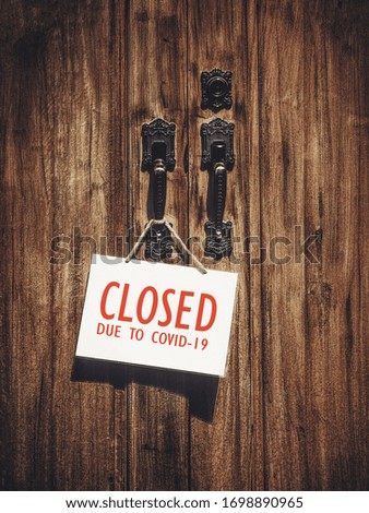 a sign hung on the door showing the closing of the business. lockdown and state of emergency concepts. schools, religious places and buildings are ordered to be closed during the coronavirus pandemic.