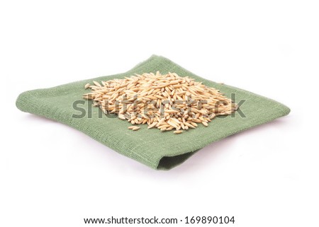grain paddy on a napkin on white background 