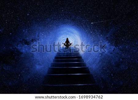 Woman in yoga pose at top of stair Royalty-Free Stock Photo #1698934762