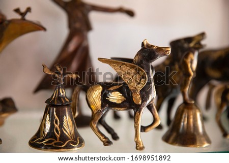 The animal statue, trinket as a decoration object on a flat background