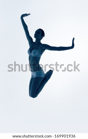 silhouette of jumping blue ballerina