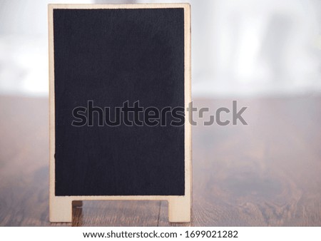 chalkboard on the wooden table background