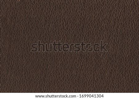 Brown soft fabric with a pattern. The texture of the curtain fabric Royalty-Free Stock Photo #1699041304