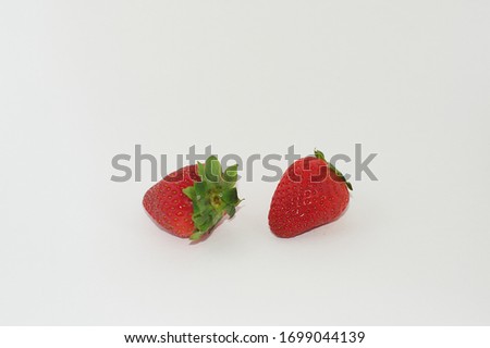 A very appetizing pair of strawberries to eat healthy and take good care of ourselves.