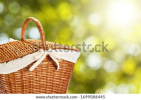 Beautiful picnic basket on a nature background