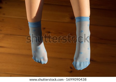 Blue socks on the child's feet