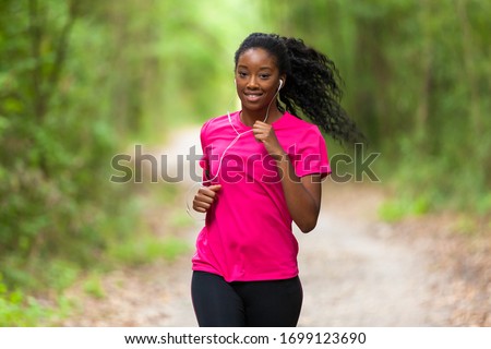 African american woman jogger portrait  - Fitness, people and healthy lifestyle Royalty-Free Stock Photo #1699123690