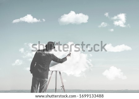 clouds creators, man painting many clouds shapes, surreal concept Royalty-Free Stock Photo #1699133488