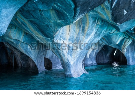 The Marble Caves (Spanish: Cuevas de Marmol ) are a series of sculpted caves in the General Carrera Lake on the border of Chile and Argentina, Patagonia, South America. Royalty-Free Stock Photo #1699154836